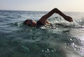 Professional triathlete practicing in open water. Swimming in se Royalty Free Stock Photo