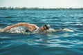 Professional triathlete swimming in river`s open water