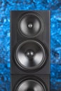 Professional two way audio speaker on blue defocused background Royalty Free Stock Photo