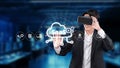 Professional using virtual reality in a modern office, showcasing cloud computing and software as a service technology Royalty Free Stock Photo