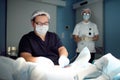 Professional vascular surgeon and assistant in the operating room of the clinic during vein surgery. Phlebectomy Royalty Free Stock Photo