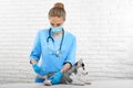 Professional veterinarian doing injection with for dog. Royalty Free Stock Photo