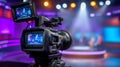 Professional video camera focused on a brightly lit stage Royalty Free Stock Photo