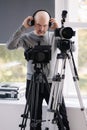 Professional video operator records the interview. Cameraman shoots video for streaming service Royalty Free Stock Photo