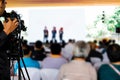 Video production camera recording live event on stage. television social media broadcasting seminar conference Royalty Free Stock Photo