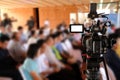 Video production camera recording live event on stage. television social media broadcasting seminar conference Royalty Free Stock Photo