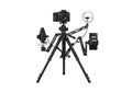 Professional video recording setup with camera, ring light, and smartphone mount Royalty Free Stock Photo