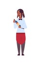 Professional waitress holding bottle of wine african american woman restaurant worker in red apron offering alcohol