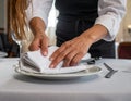 Professional Waitstaff Setting Up Elegant Table for Dining Experience Royalty Free Stock Photo