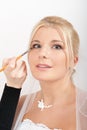 Professional wedding make-up is made to bride Royalty Free Stock Photo