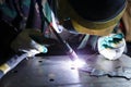 Professional welder in protective mask welding with electric torch Royalty Free Stock Photo