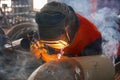 A professional welder welds a pipe with a diameter of DN250 for the process pipeline and fixes the defective sections of the seam