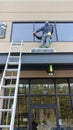 Professional Window Cleaner on an awning