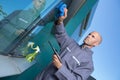 professional window cleaner cleaning outdoor panes Royalty Free Stock Photo