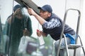 professional window cleaner uses squeegee Royalty Free Stock Photo