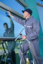 Professional window cleaner at work outdoors Royalty Free Stock Photo