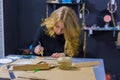 Professional woman decorator working with kraft paper