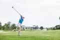 Professional woman golfer practice in golf course Royalty Free Stock Photo