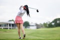 Professional woman golfer practice in golf course Royalty Free Stock Photo