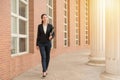 Professional woman lawyer walking in court outdoor