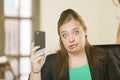 Professional Woman Reacting to Phone Content Royalty Free Stock Photo