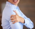 Professional woman with shoulder pain, hand on injury and closeup with medical problem, muscle tension and hurt. Health