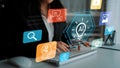 Professional woman typing on keyboard surrounded by digital icons representing technology, creativity, and artificial Royalty Free Stock Photo