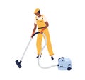 Professional worker of cleaning service working with vacuum cleaner. Man in uniform and gloves using manual hoover for Royalty Free Stock Photo