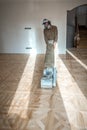 Professional worker grinding a parquet floor with special machine Royalty Free Stock Photo