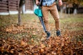 worker, man using leaf blower for autumn cleaning Royalty Free Stock Photo