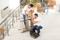 Professional workers disassembling rack. Moving service Royalty Free Stock Photo