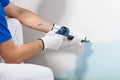 Professional Workman Applying Silicone Sealant With Caulking Gun