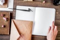 writer workplace with tools on wooden background top view