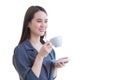 Professional young Asian confident working woman is looking out of window to think something while holds coffee cup in her hand Royalty Free Stock Photo