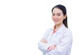 Professional young Asian woman doctor wearing white robe standing with arms crossed happy and smile at examination room in Royalty Free Stock Photo