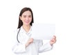 Professional young Asian woman doctor who wears medical coat holds and shows white paper to present something in healthcare Royalty Free Stock Photo