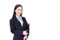 Professional young Asian woman office worker in black suit holds clipboard in her hands and confident smiles in office room while Royalty Free Stock Photo