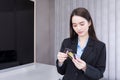 Professional young Asian woman office worker is choosing credit cards to use pay goods it is financial choice easy pay in office Royalty Free Stock Photo