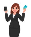 Professional young business woman showing/holding new latest mobile, cell, smartphone and credit/debit/ATM banking card in hand. Royalty Free Stock Photo