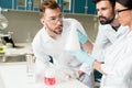 Professional young chemists working together in laboratory Royalty Free Stock Photo