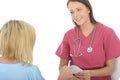 Professional Young Female Doctor Giving a Female Patient a Prescription Royalty Free Stock Photo