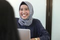 Professional young hijab muslim girl working with laptop, young muslim woman interviewing