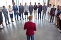 Professional leader standing in front of his business team and talk Royalty Free Stock Photo