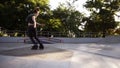 Professional young man make a 360 trick on ramp. Aggressive in-line skates on roller skater feet.Roller blader wearing