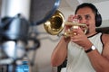 Young man playing trumpet in studio Royalty Free Stock Photo