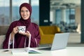 Professional young muslim business woman using mobile digital tablet computer at work Royalty Free Stock Photo