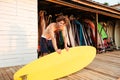 Professional young surfer getting surf board ready Royalty Free Stock Photo