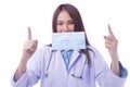 Woman doctor in uniform white clothes with stethoscope while showing medical mask protection from inhaling Royalty Free Stock Photo