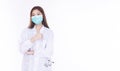 Professional young woman doctor wear uniform coat and mask while showing thumb up for good job over isolated white background. Royalty Free Stock Photo