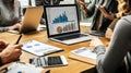 Data Analytics Team Meeting with Charts & Graphs on Laptop Royalty Free Stock Photo